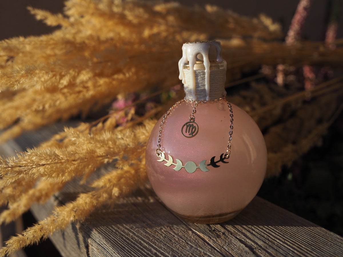 Magic potion decoration with Zodiac charm